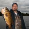 An Angler With Smallmouth Bass At Hideaway Lodge