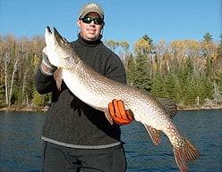A Happy Hideaway Lodge Angler With A Northern Pike